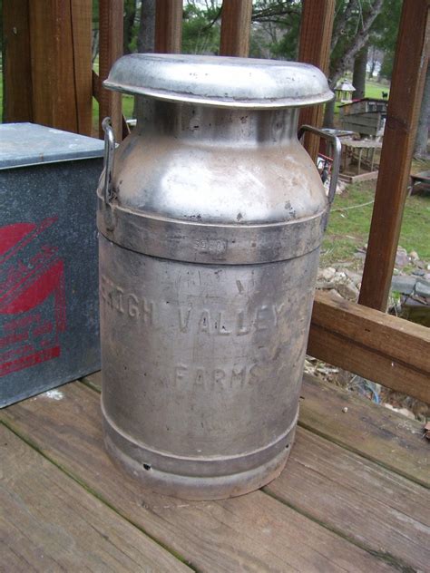 vintage metal milk containers